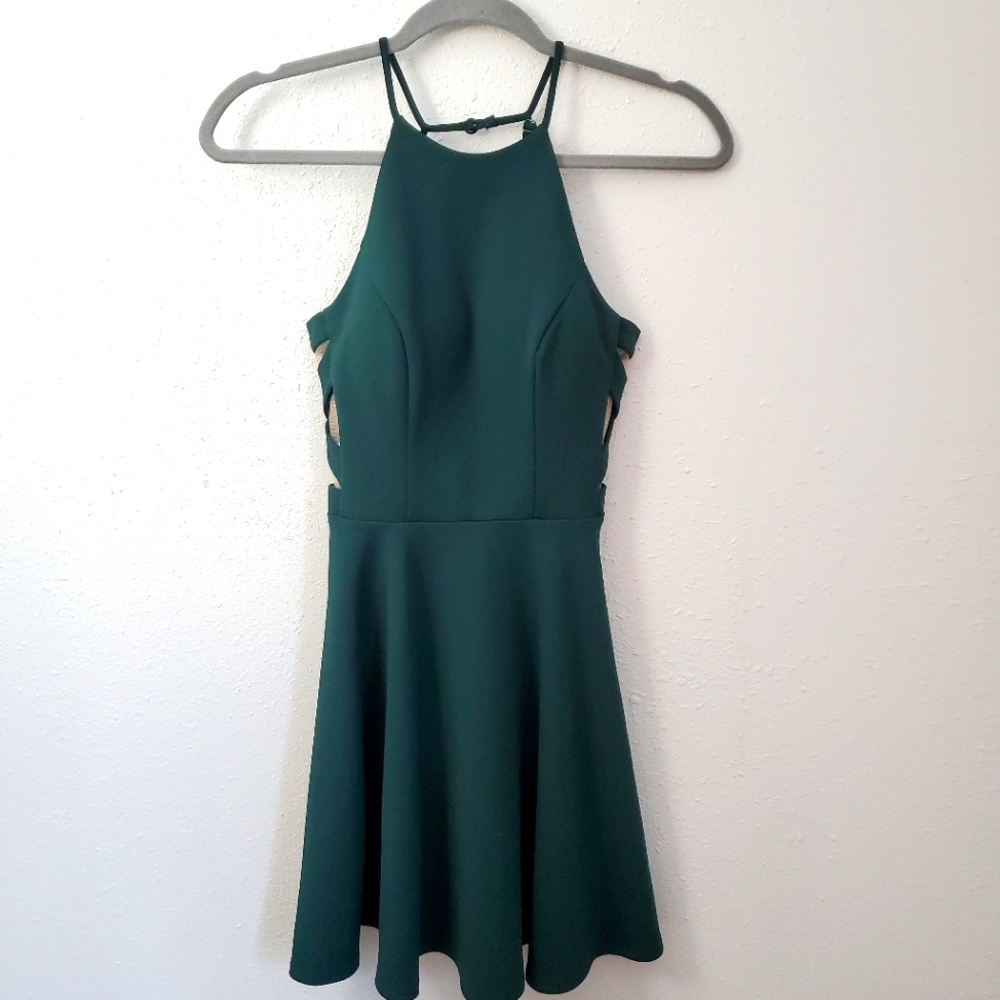 B. Darlin mini strappy dress with open sides and deep back size 1/2.